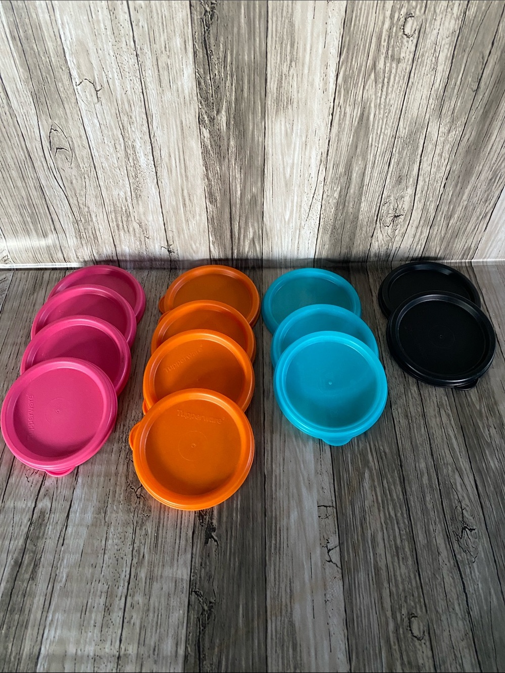 Assortment of 13 Tupperware drinking cup replacement lids